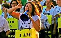 Protesters in a rally for immigrant workers in Los Angeles carry signs reading "I Am A Human Being."
